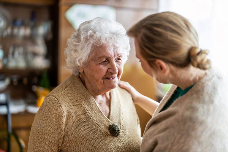 An elderly resident in Leicestershire enjoying daily activities at home with the assistance of a local home care worker.